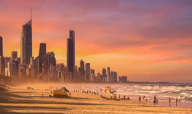 A group of friends on a Gold Coast beach; part of the Sunny community network that supports faster response times for locals in need.